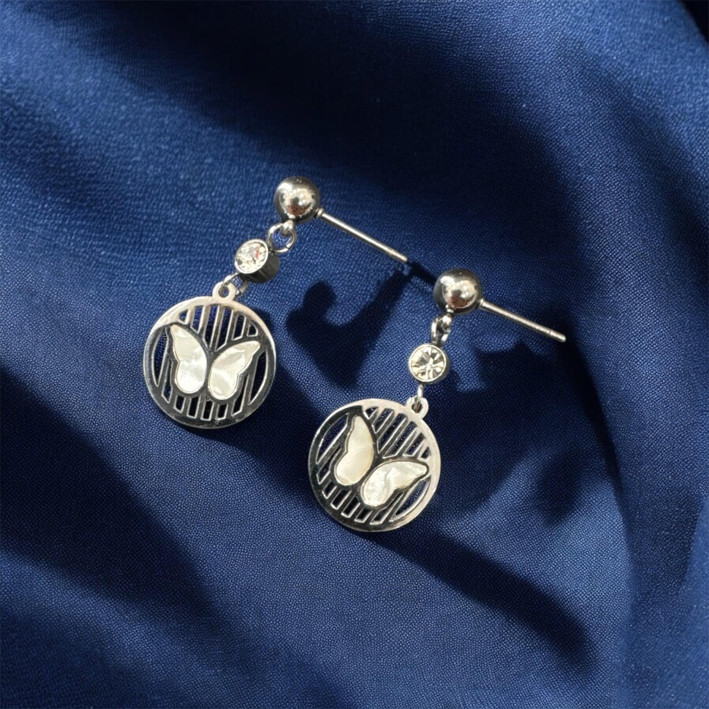 Elegant Silver Finish Mother-of-Pearl Butterfly Earrings with Diamond Dangle